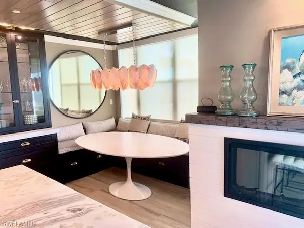 a bathroom with a granite countertop sink mirror and window