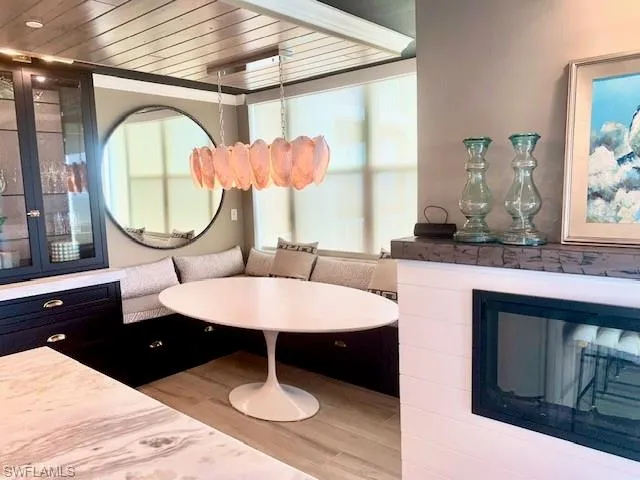 a bathroom with a granite countertop sink mirror and window