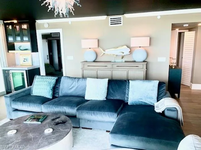 a living room with furniture and white walls