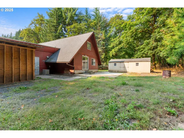 a view of a house with a backyard