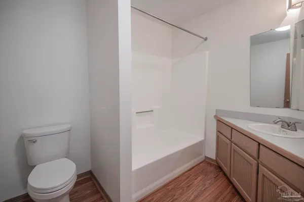 a bathroom with a tub and a sink