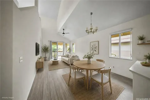 a view of a livingroom with furniture window and wooden floor