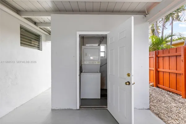 a view of an entryway with wooden floor