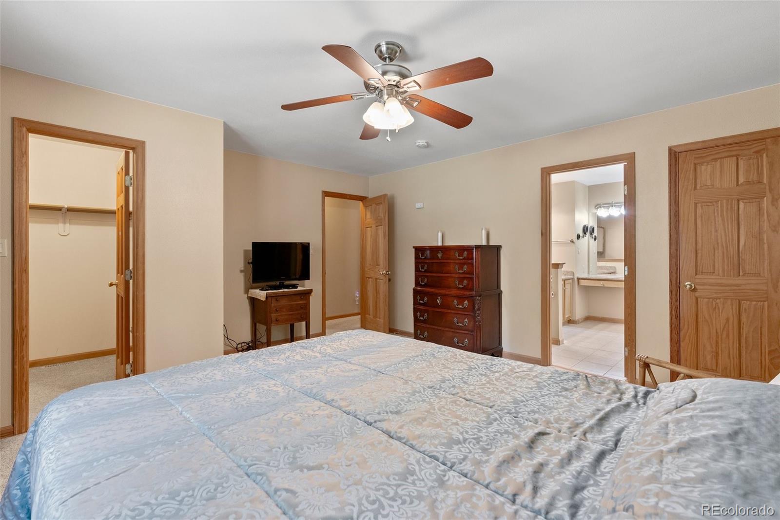 29 Cedar Lane Bailey, CO 80421 - Photo 13 of 46 a bedroom with a bed and a flat screen tv