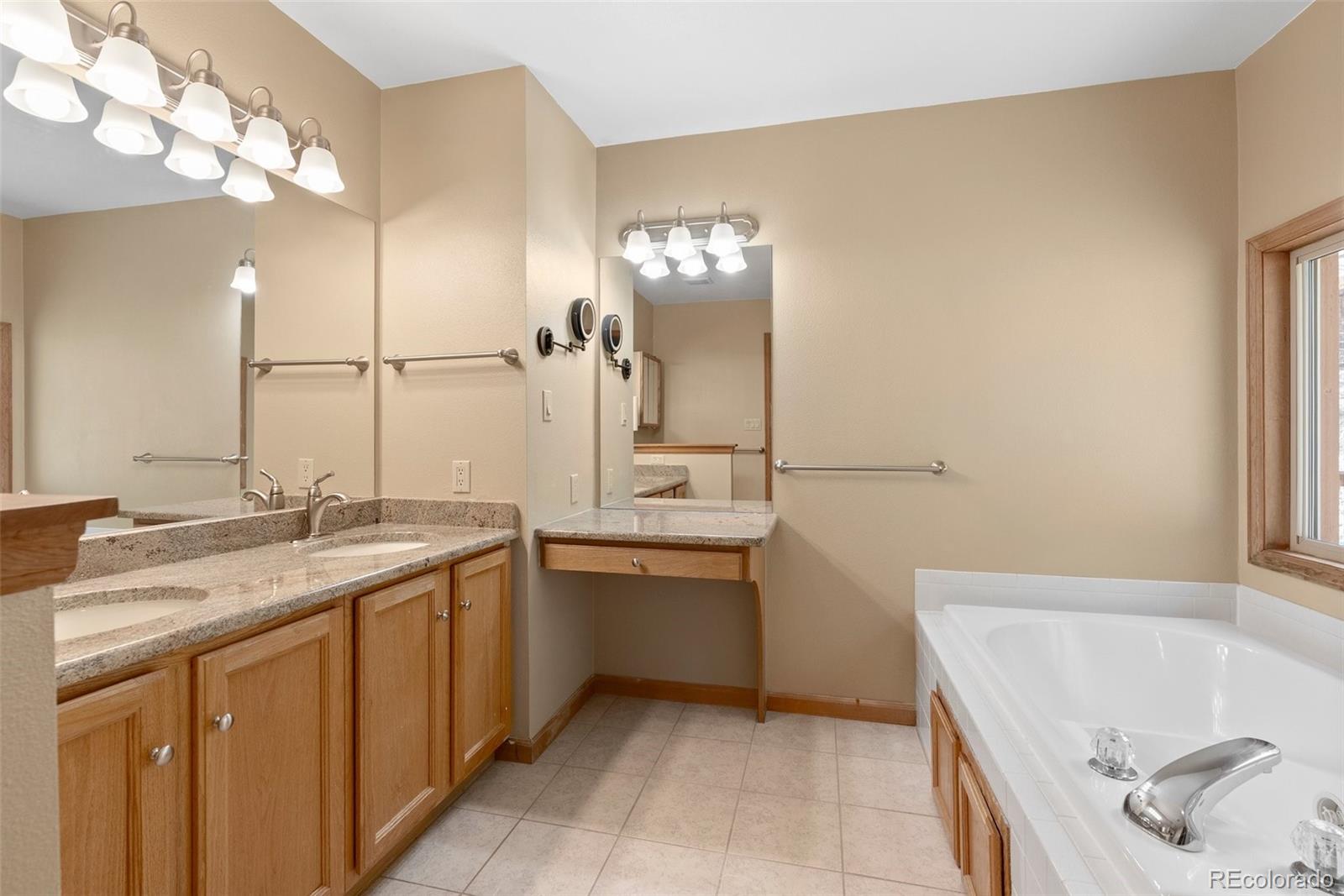 29 Cedar Lane Bailey, CO 80421 - Photo 14 of 46 a bathroom with a tub sink and mirror