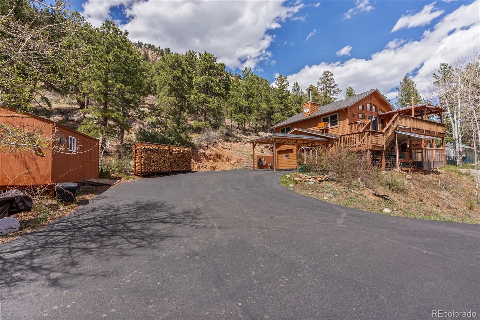 29 Cedar Lane Bailey, CO 80421 - Photo 2 of 46 a view of a house with a yard