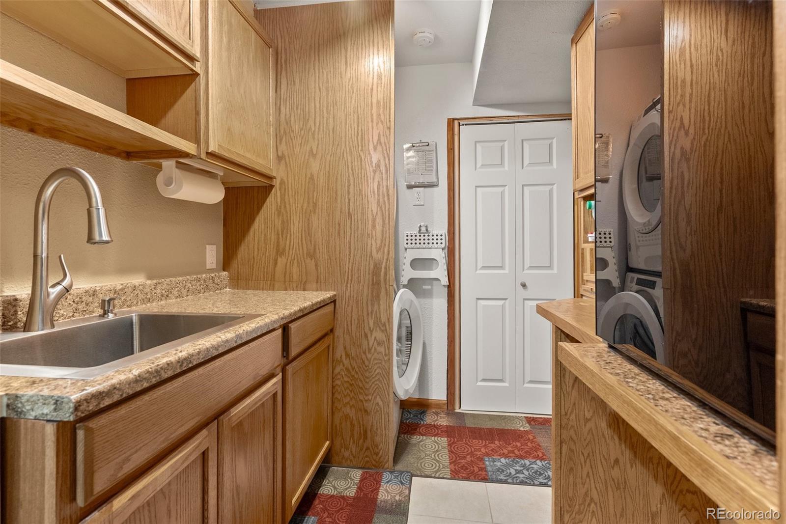 29 Cedar Lane Bailey, CO 80421 - Photo 22 of 46 a kitchen with a sink and a refrigerator