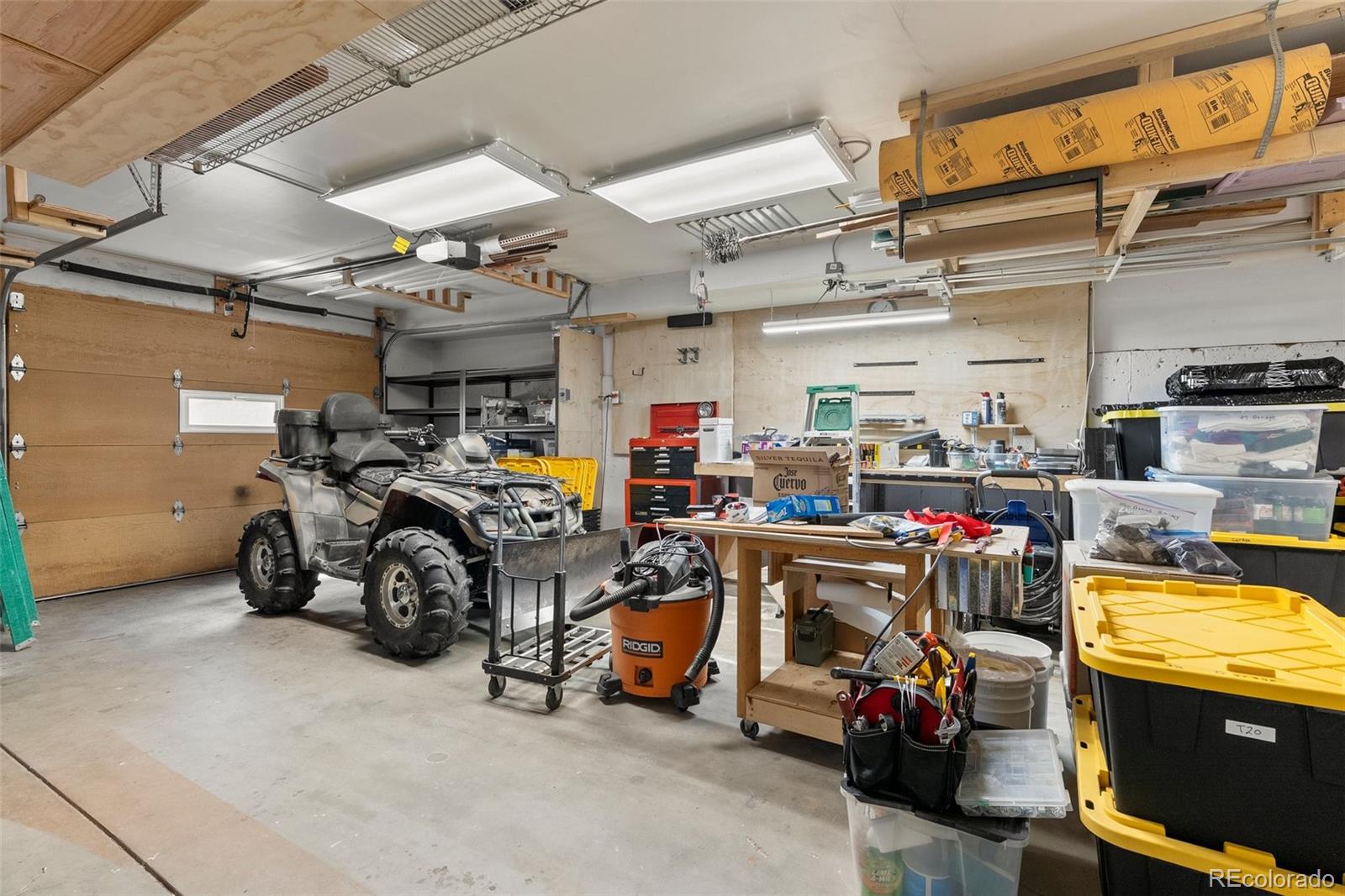 29 Cedar Lane Bailey, CO 80421 - Photo 24 of 46 a view of a garage with parked cars