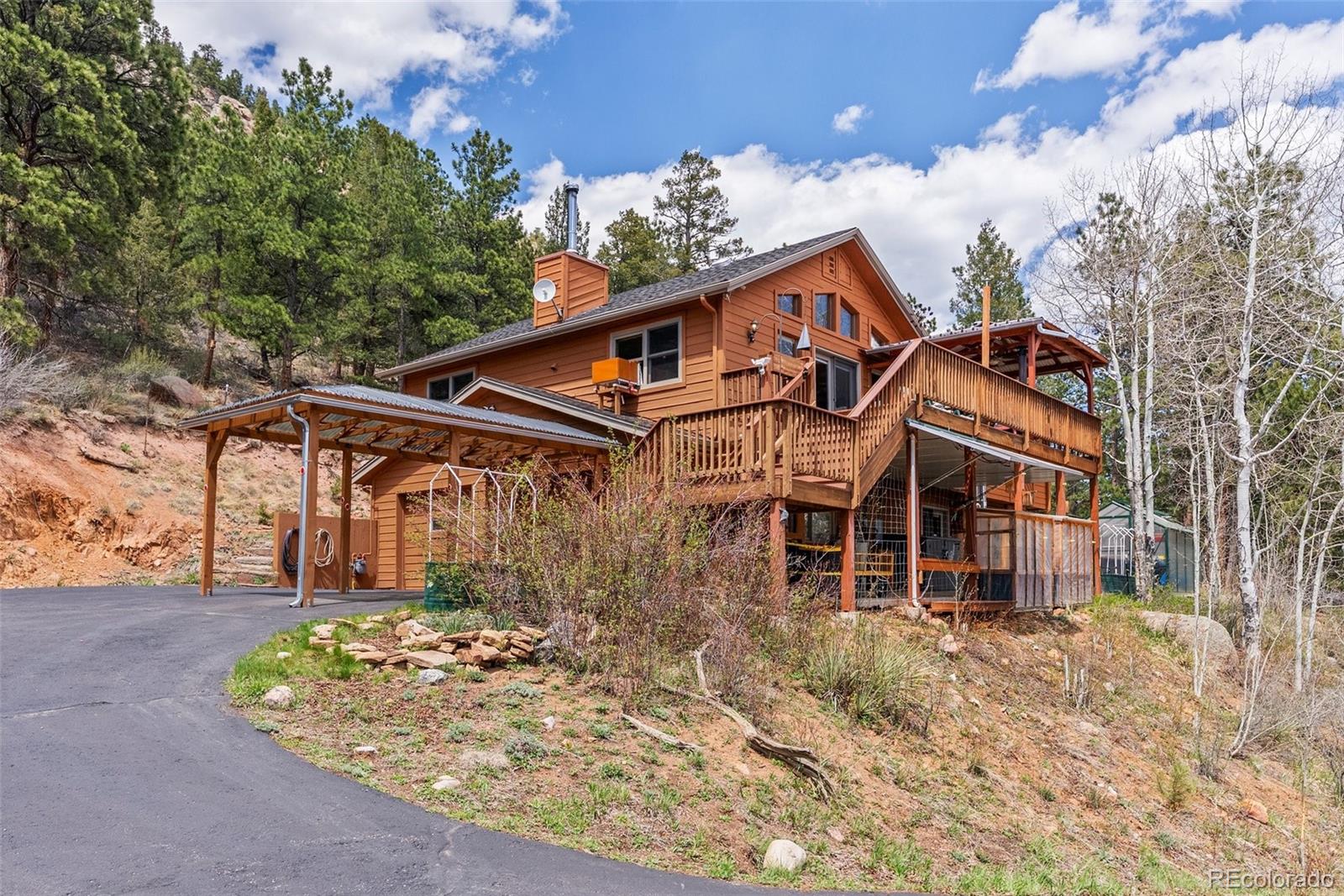 29 Cedar Lane Bailey, CO 80421 - Photo 3 of 46 front view of a house with a yard