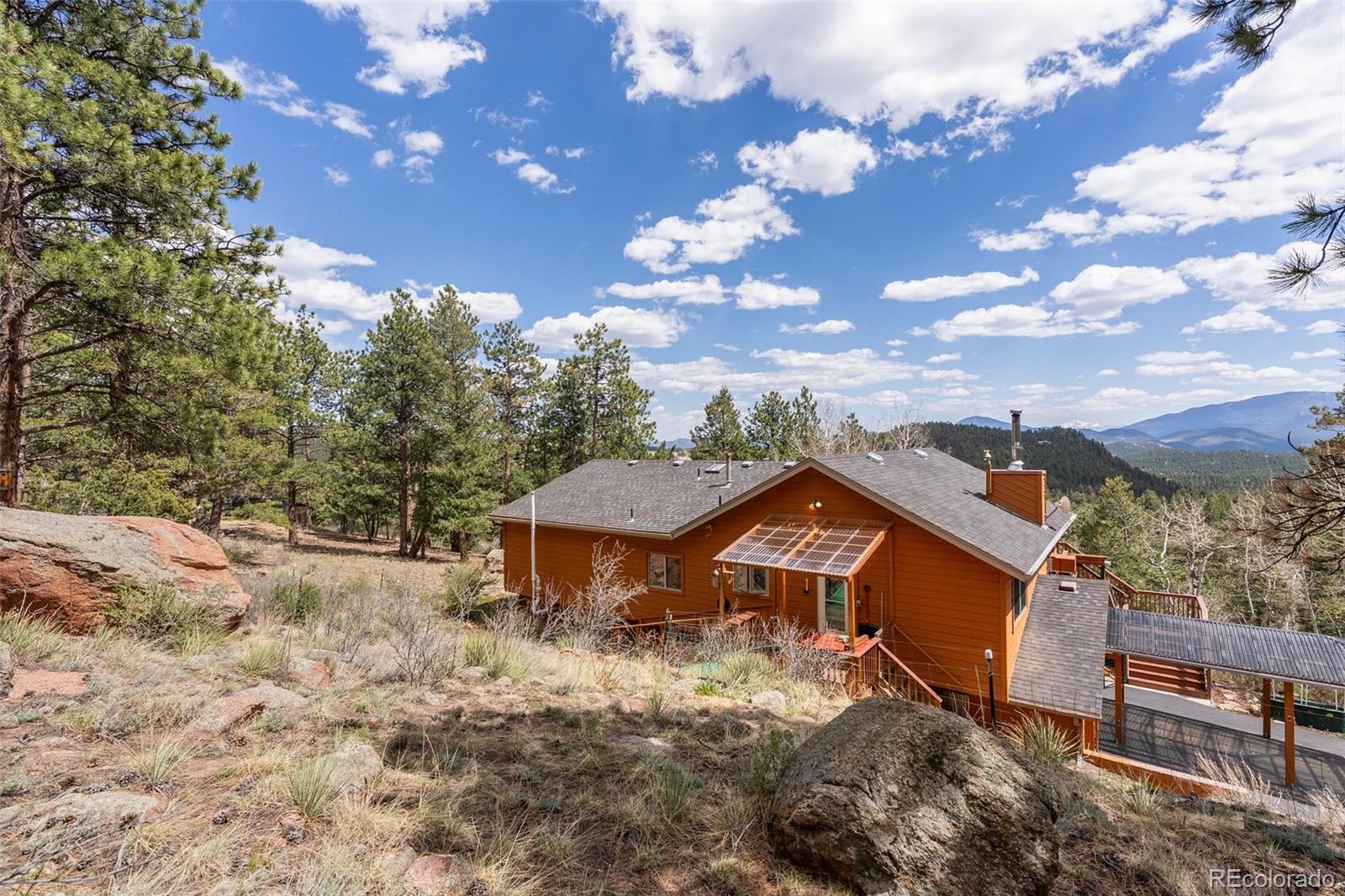 29 Cedar Lane Bailey, CO 80421 - Photo 38 of 46 a view of a house with a yard