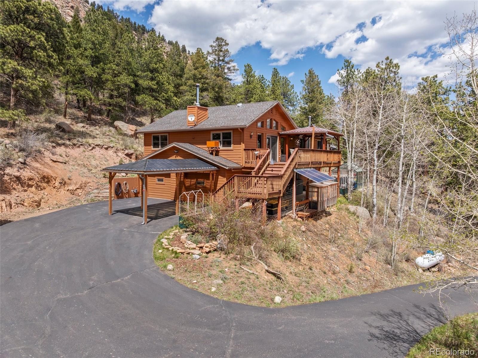 29 Cedar Lane Bailey, CO 80421 - Photo 39 of 46 an aerial view of a house with swimming pool and porch