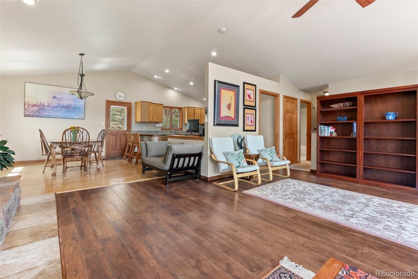 29 Cedar Lane Bailey, CO 80421 - Photo 5 of 46 a living room with furniture a rug and gym equipment