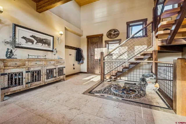 a view of a livingroom with furniture and a window