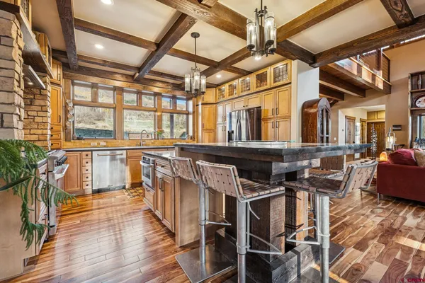a view of a kitchen with seating area