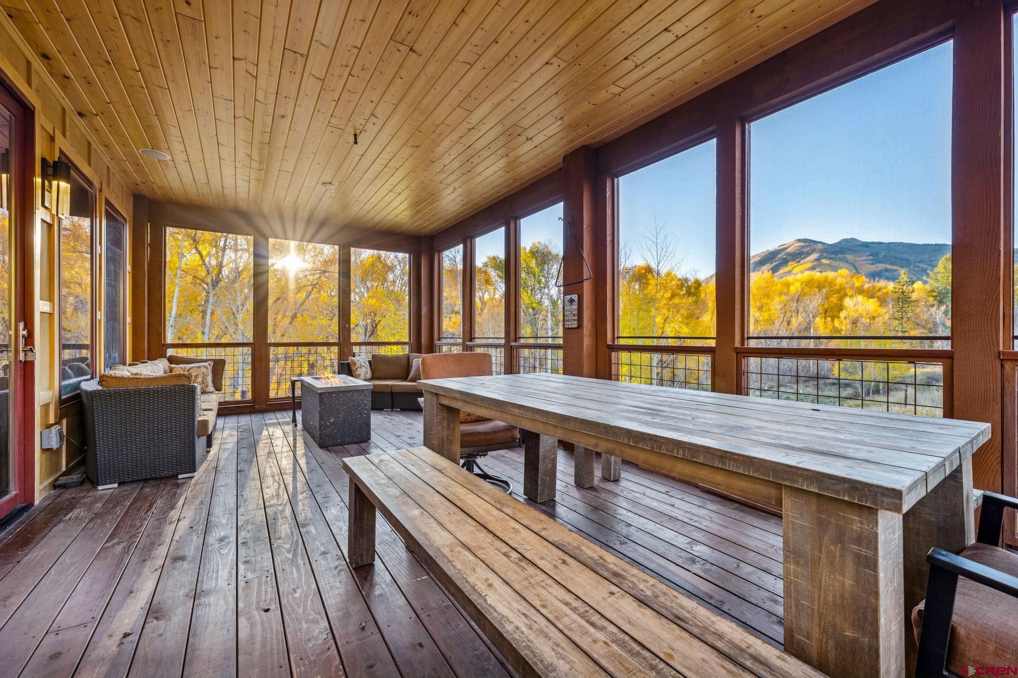 125 Quaking Aspen Road Durango, CO 81301 - Photo 16 of 45 a living room with furniture and large windows