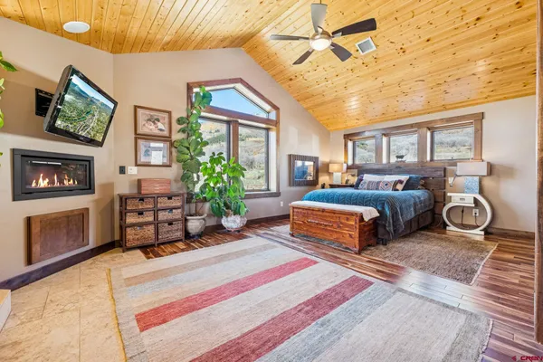 a bedroom with furniture and a fireplace