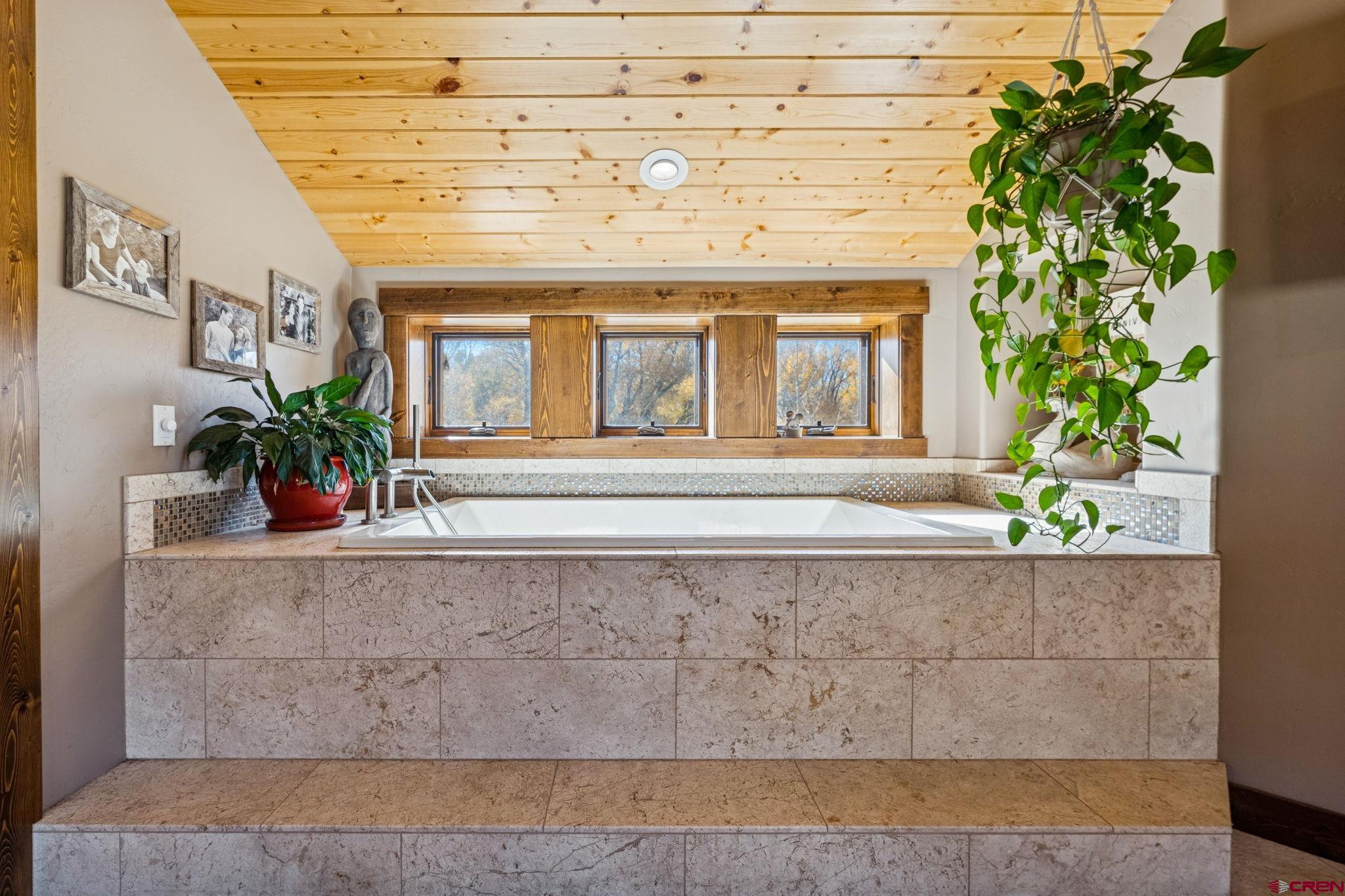 125 Quaking Aspen Road Durango, CO 81301 - Photo 21 of 45 a view of a brick house with a potted plant