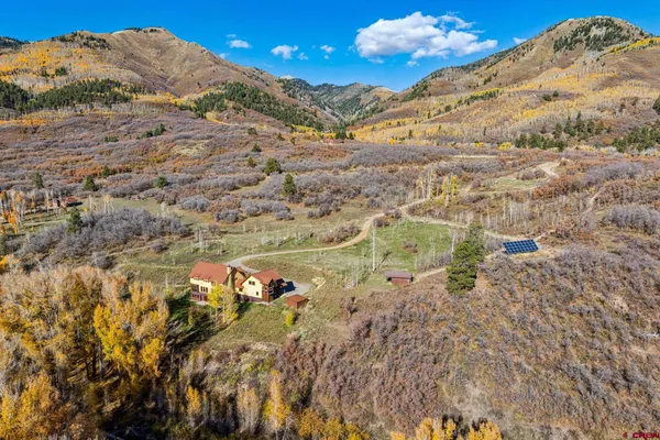 a view of a dry yard with mountains