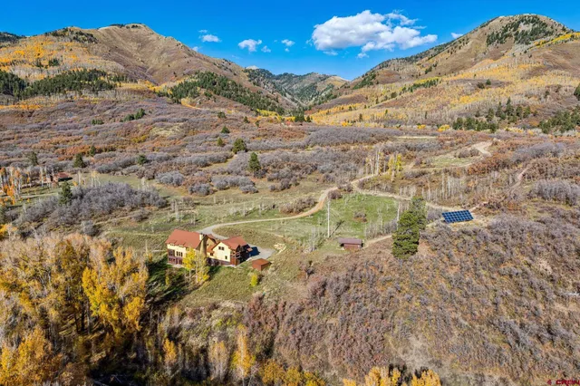 a view of a dry yard with mountains