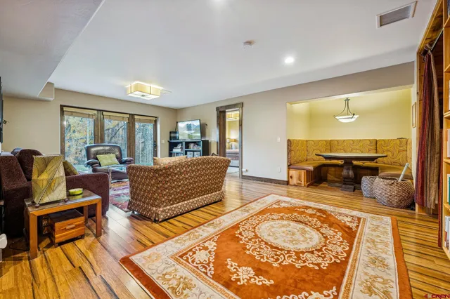 a bedroom with furniture and a rug