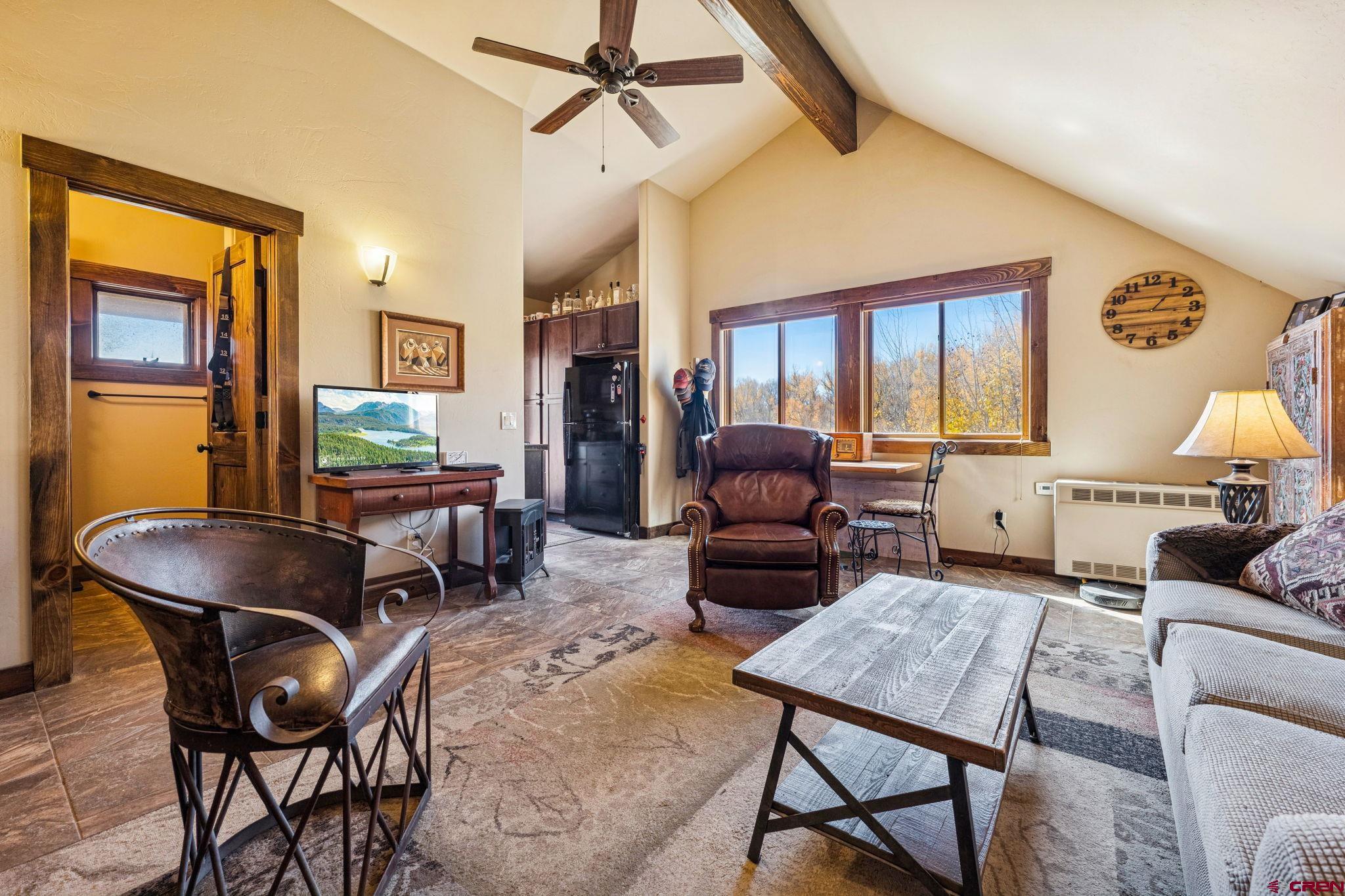 125 Quaking Aspen Road Durango, CO 81301 - Photo 37 of 45 a living room with furniture a rug and a window