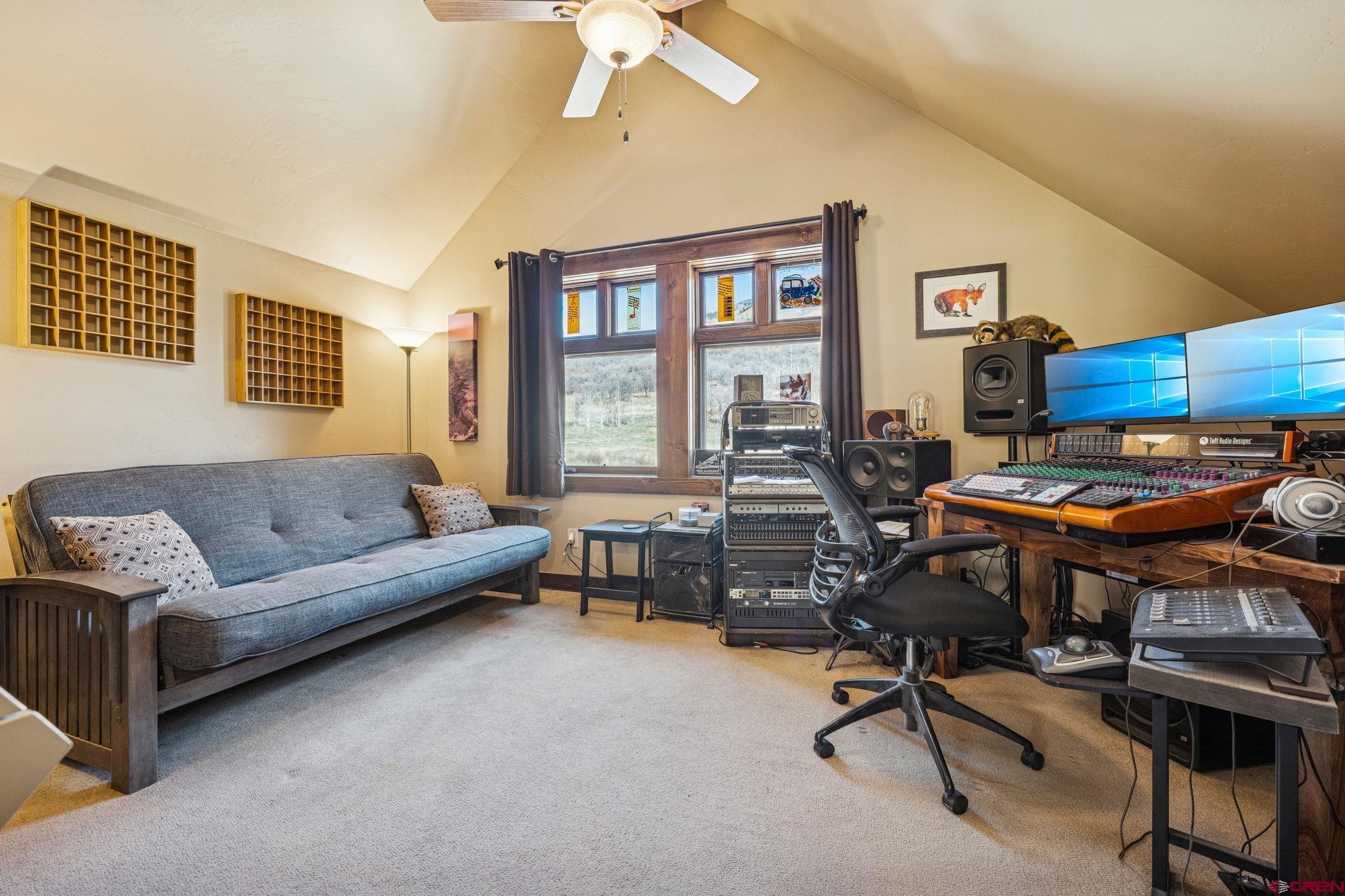 125 Quaking Aspen Road Durango, CO 81301 - Photo 39 of 45 a living room with furniture and a window