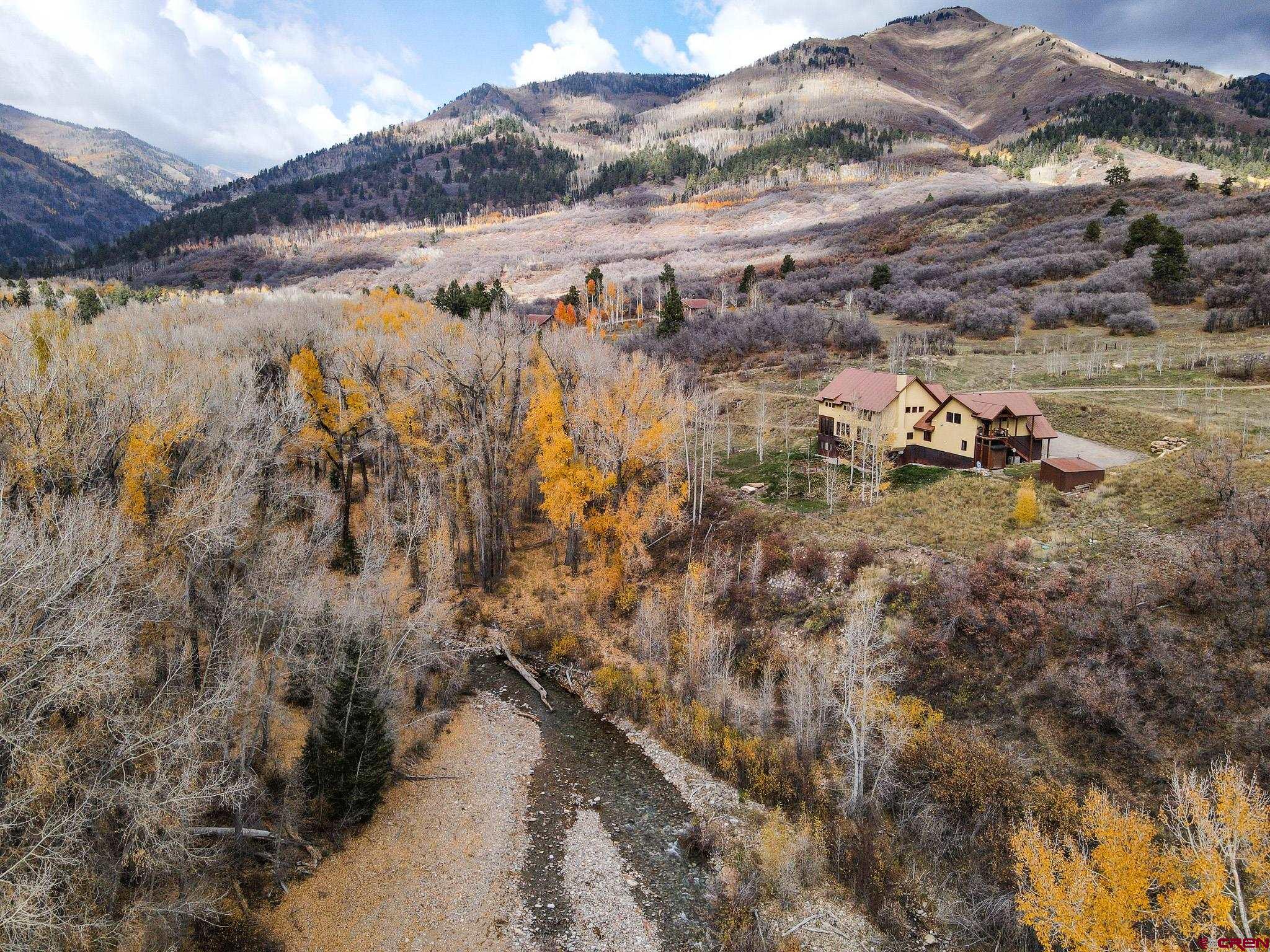 125 Quaking Aspen Road Durango, CO 81301 - Photo 4 of 45 a view of a lake with mountains in the background