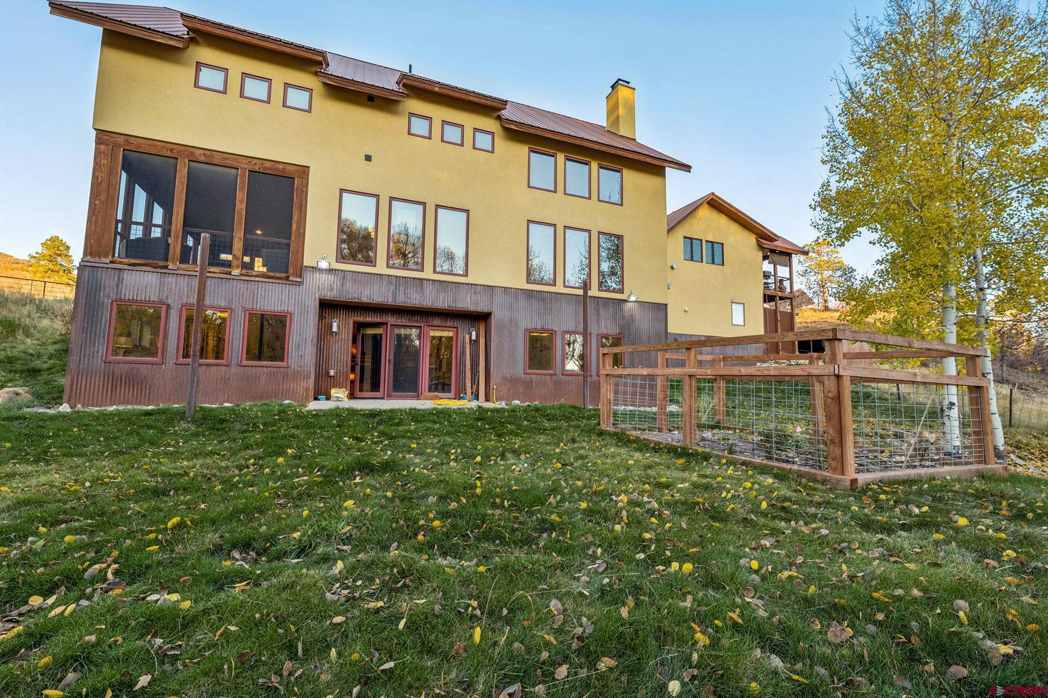 125 Quaking Aspen Road Durango, CO 81301 - Photo 41 of 45 a front view of a house with a yard