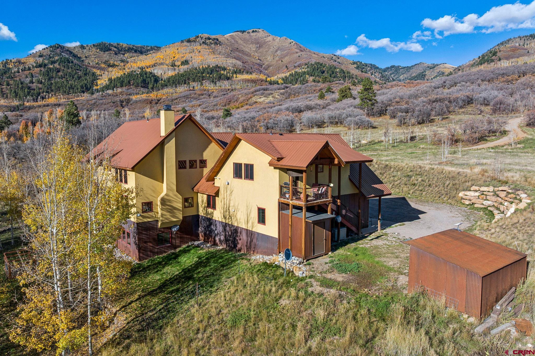 125 Quaking Aspen Road Durango, CO 81301 - Photo 6 of 45 an aerial view of a house with a lake view