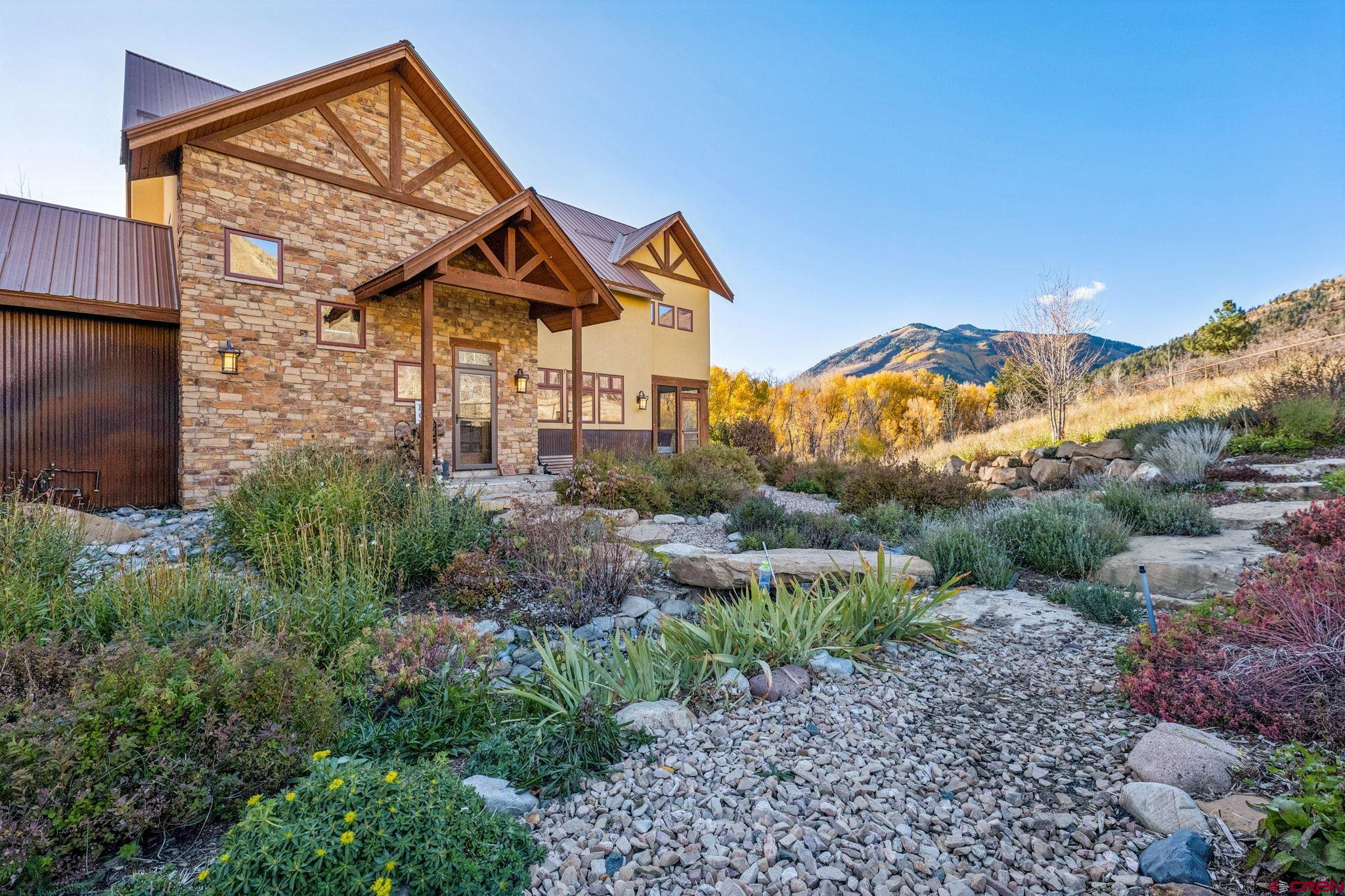 125 Quaking Aspen Road Durango, CO 81301 - Photo 8 of 45 a view of a house with a yard and pathway