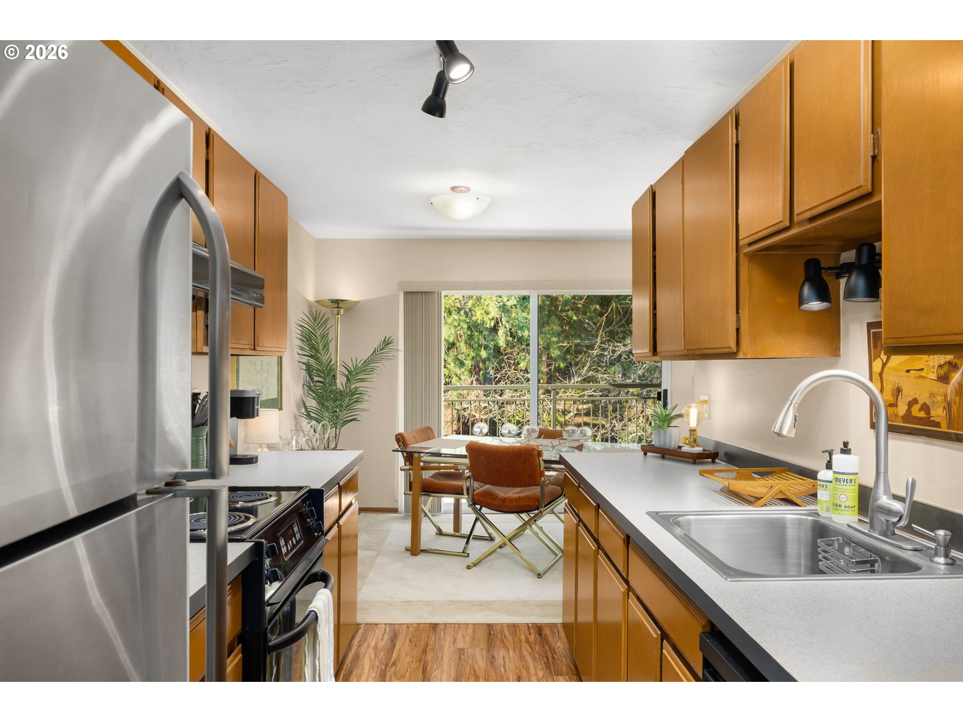 2393 Southwest Park Place, Unit 302 Portland, OR 97205 - Photo 11 of 35 a kitchen with a sink appliances and cabinets