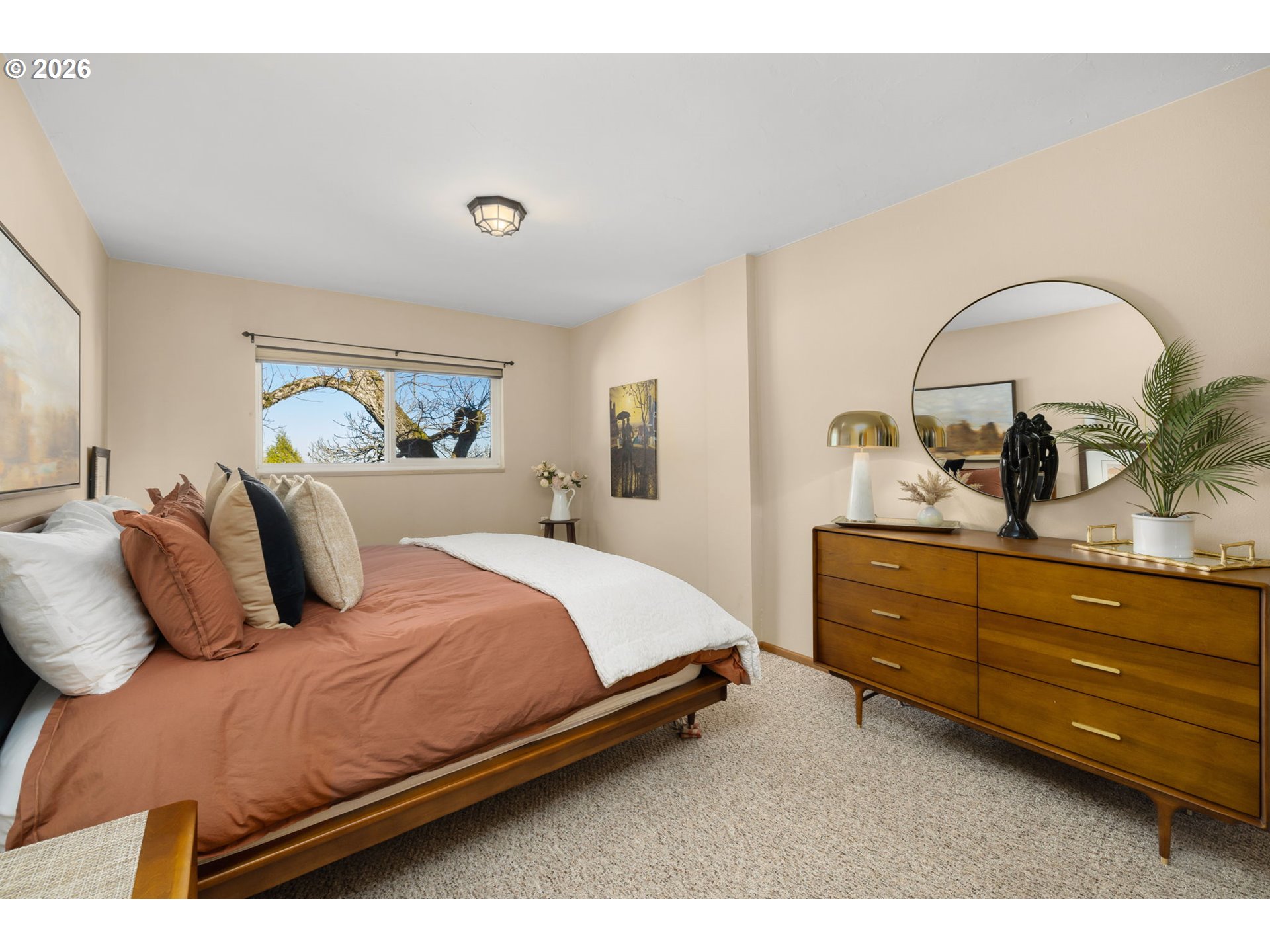 2393 Southwest Park Place, Unit 302 Portland, OR 97205 - Photo 20 of 35 a bedroom with a bed and a dresser