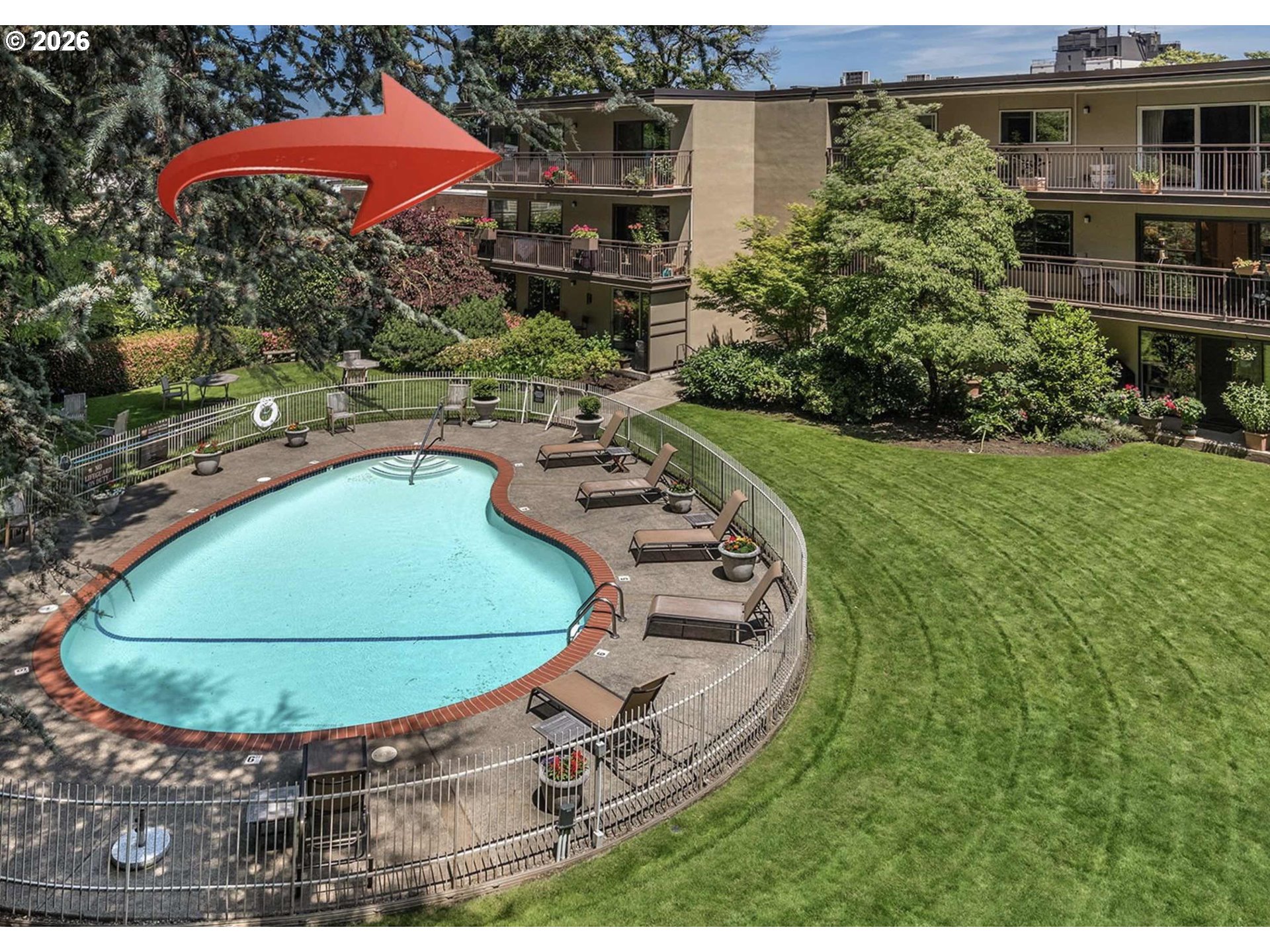 2393 Southwest Park Place, Unit 302 Portland, OR 97205 - Photo 2 of 35 a view of a swimming pool with a yard