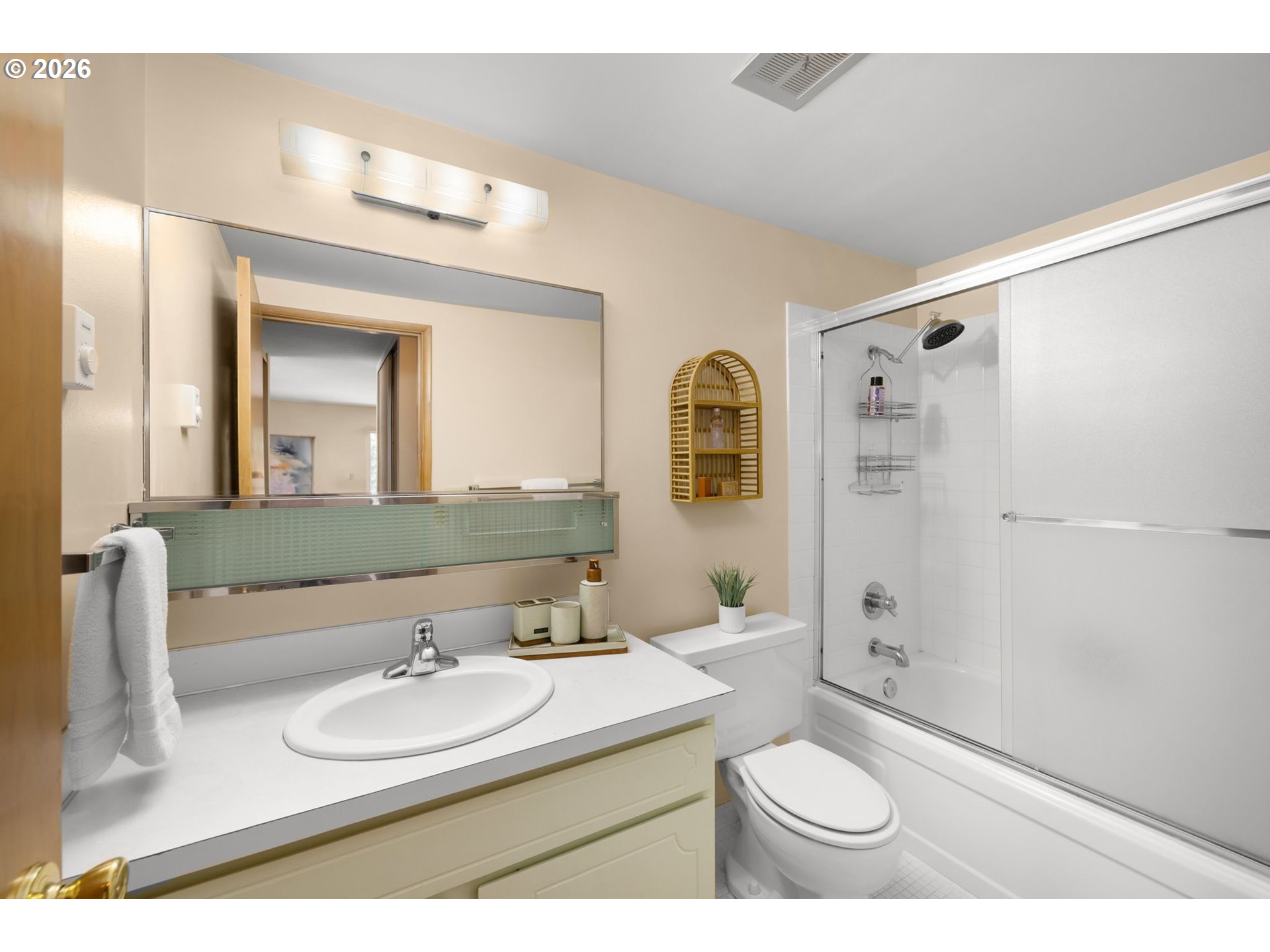 2393 Southwest Park Place, Unit 302 Portland, OR 97205 - Photo 27 of 35 a bathroom with a double vanity sink toilet mirror and shower