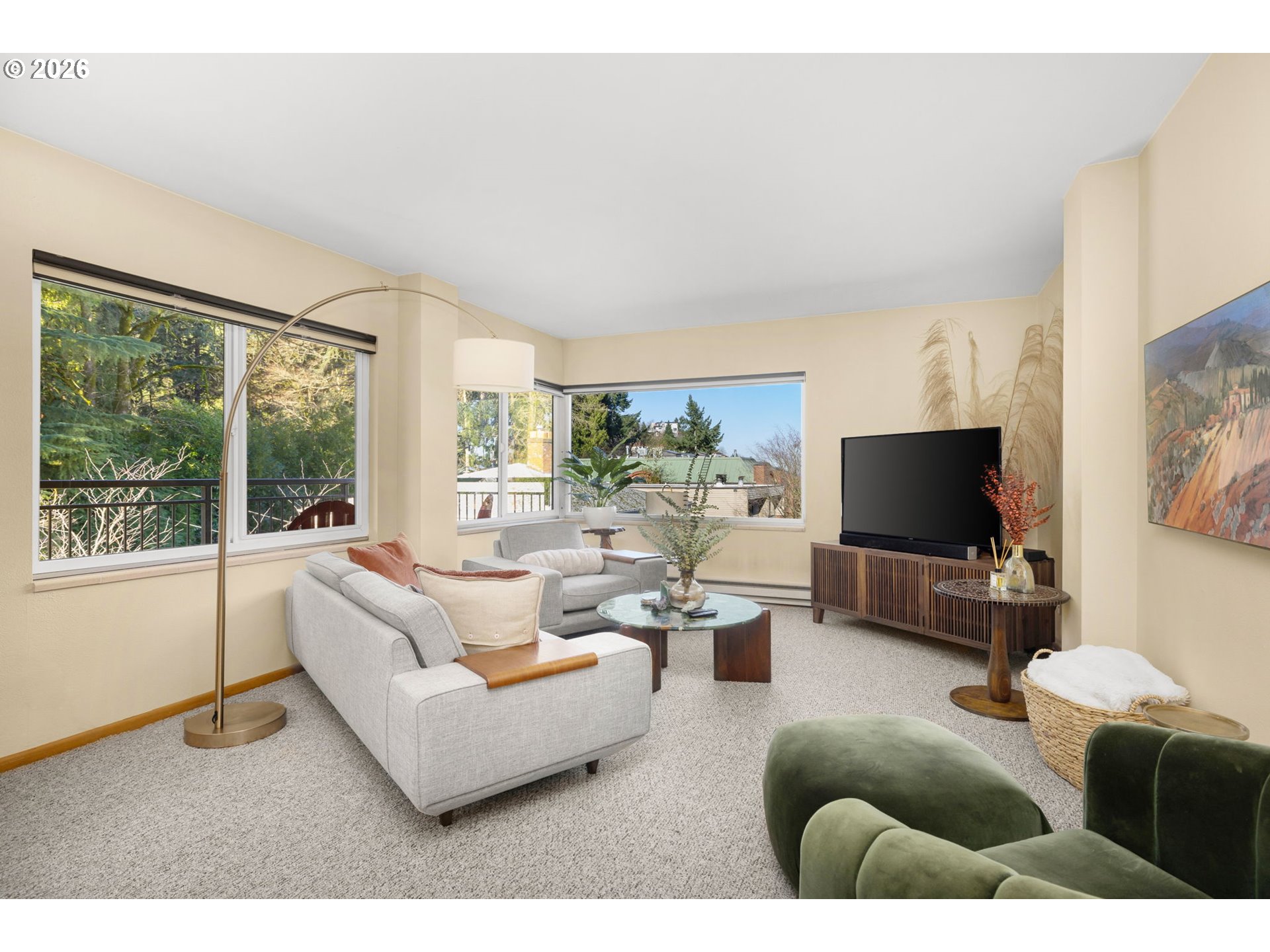 2393 Southwest Park Place, Unit 302 Portland, OR 97205 - Photo 4 of 35 a living room with furniture and a flat screen tv