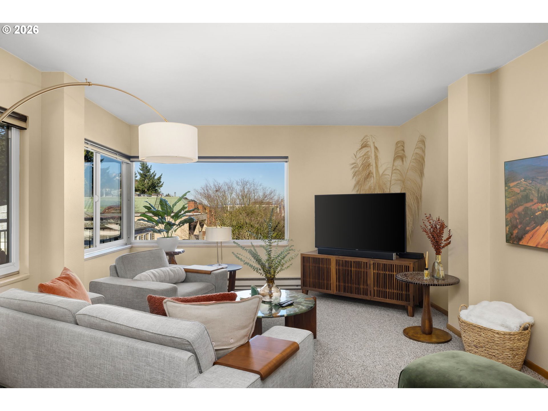 2393 Southwest Park Place, Unit 302 Portland, OR 97205 - Photo 5 of 35 a living room with furniture and a flat screen tv