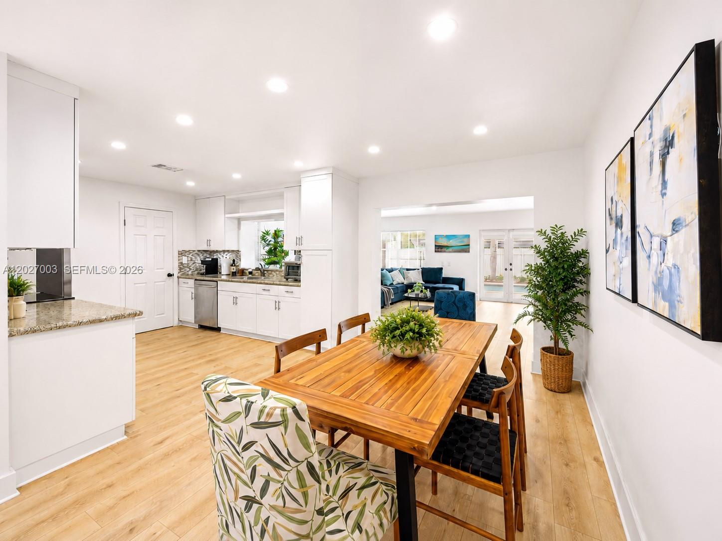 2761 Southwest 92nd Place Miami, FL 33165 - Photo 7 of 37 a kitchen with a table and chairs in it
