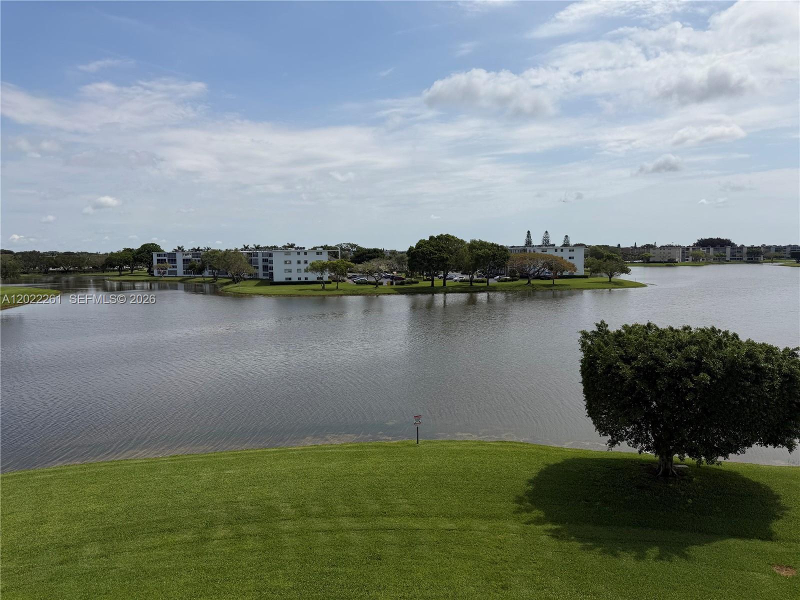 4043 Cornwall C, Unit 4043 Boca Raton, FL 33434 - Photo 8 of 16 a view of a lake with a city