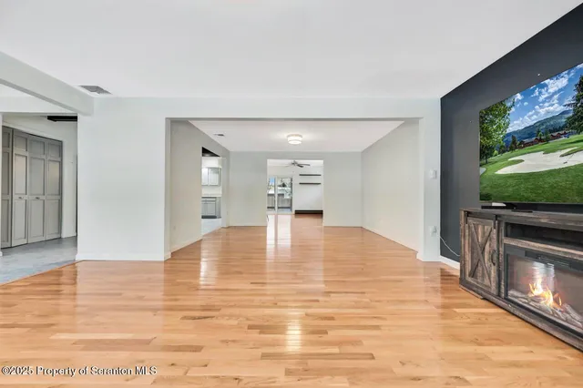 a kitchen with stainless steel appliances granite countertop a refrigerator and a stove