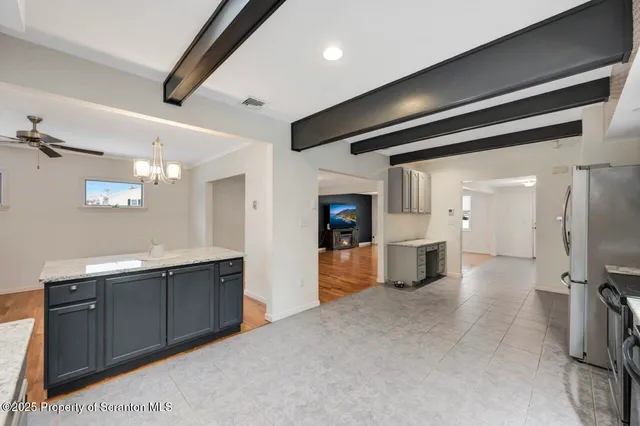 a bathroom with a sink a toilet and a shower