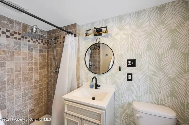 a kitchen with stainless steel appliances granite countertop a refrigerator a stove and a sink