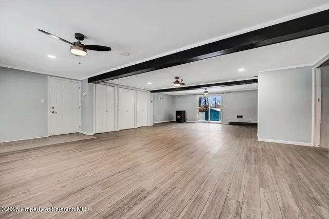 a view of a house with a snow in the yard