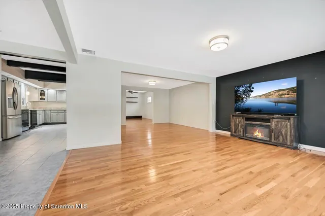 wooden floor in an empty room with a workspace