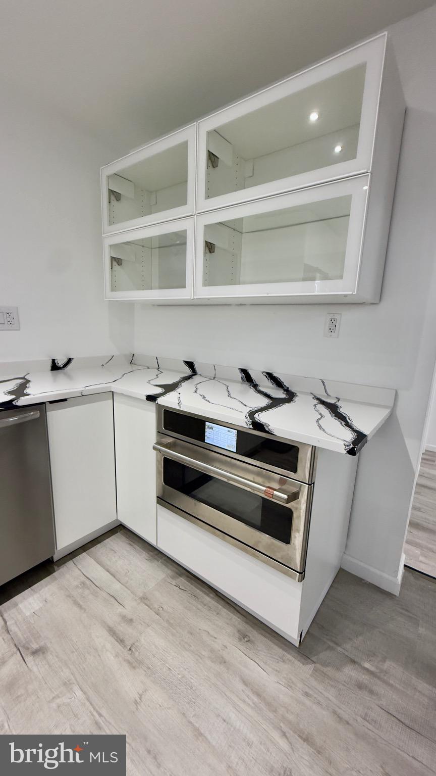 2319 Fairview Avenue Reading, PA 19606 - Photo 12 of 58 a utility room with stainless steel appliances wooden floor and a sink