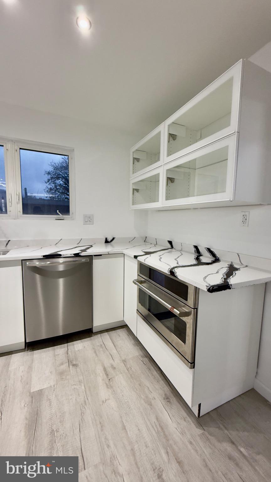 2319 Fairview Avenue Reading, PA 19606 - Photo 14 of 58 a white kitchen with granite countertop a stove top oven