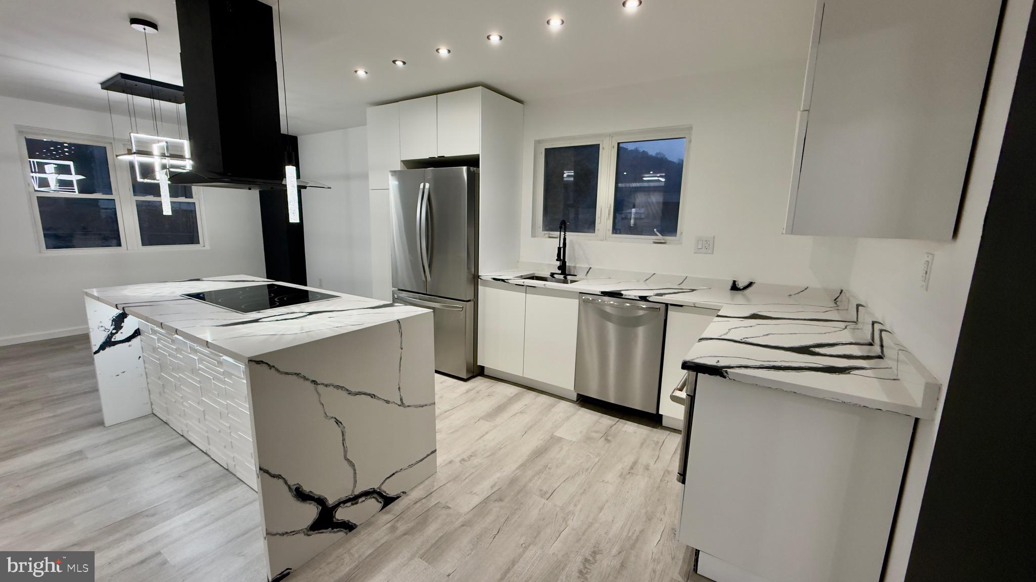 2319 Fairview Avenue Reading, PA 19606 - Photo 18 of 58 a kitchen with a sink stove and refrigerator