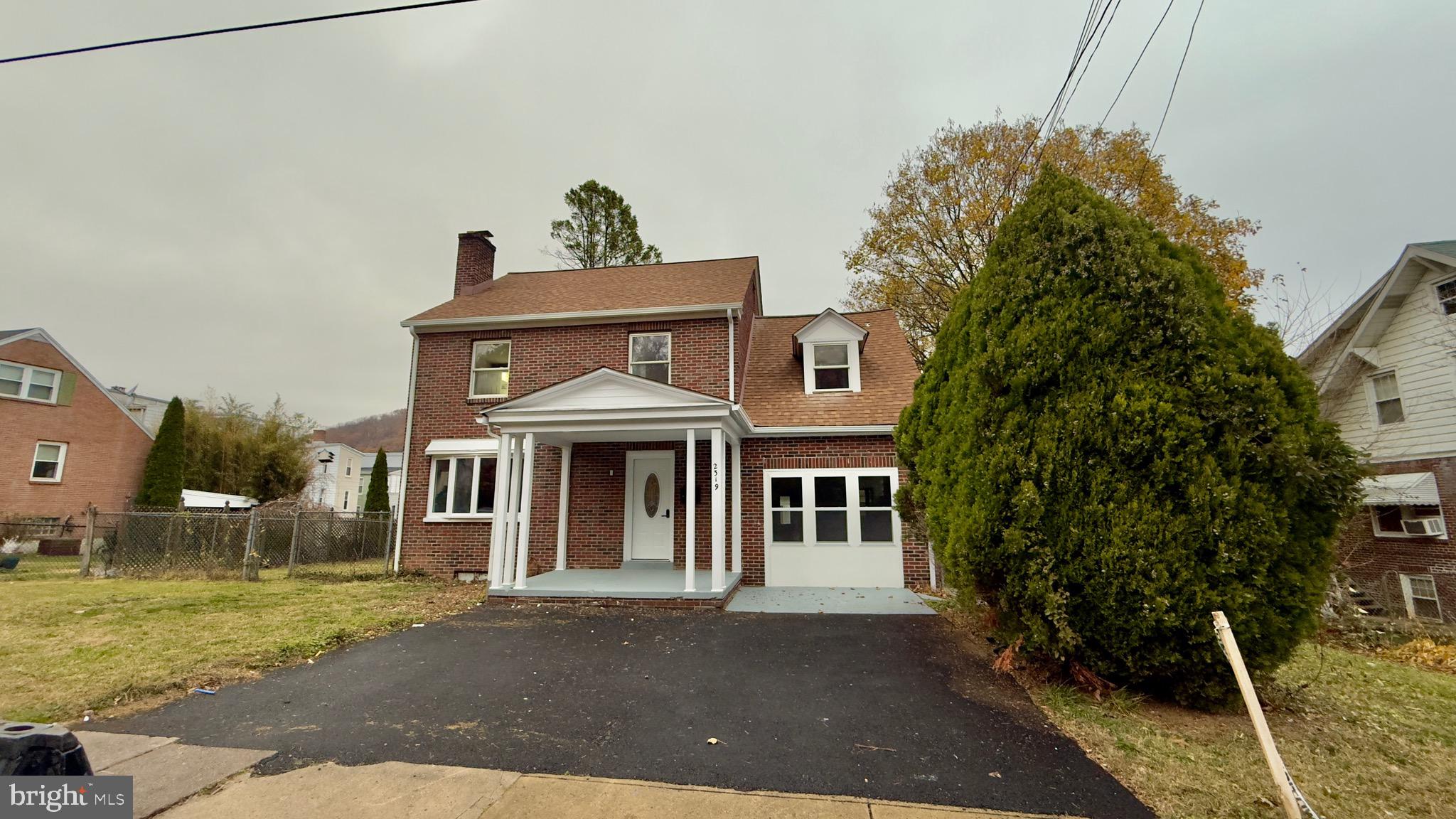 2319 Fairview Avenue Reading, PA 19606 - Photo 2 of 58 a front view of a house with a yard