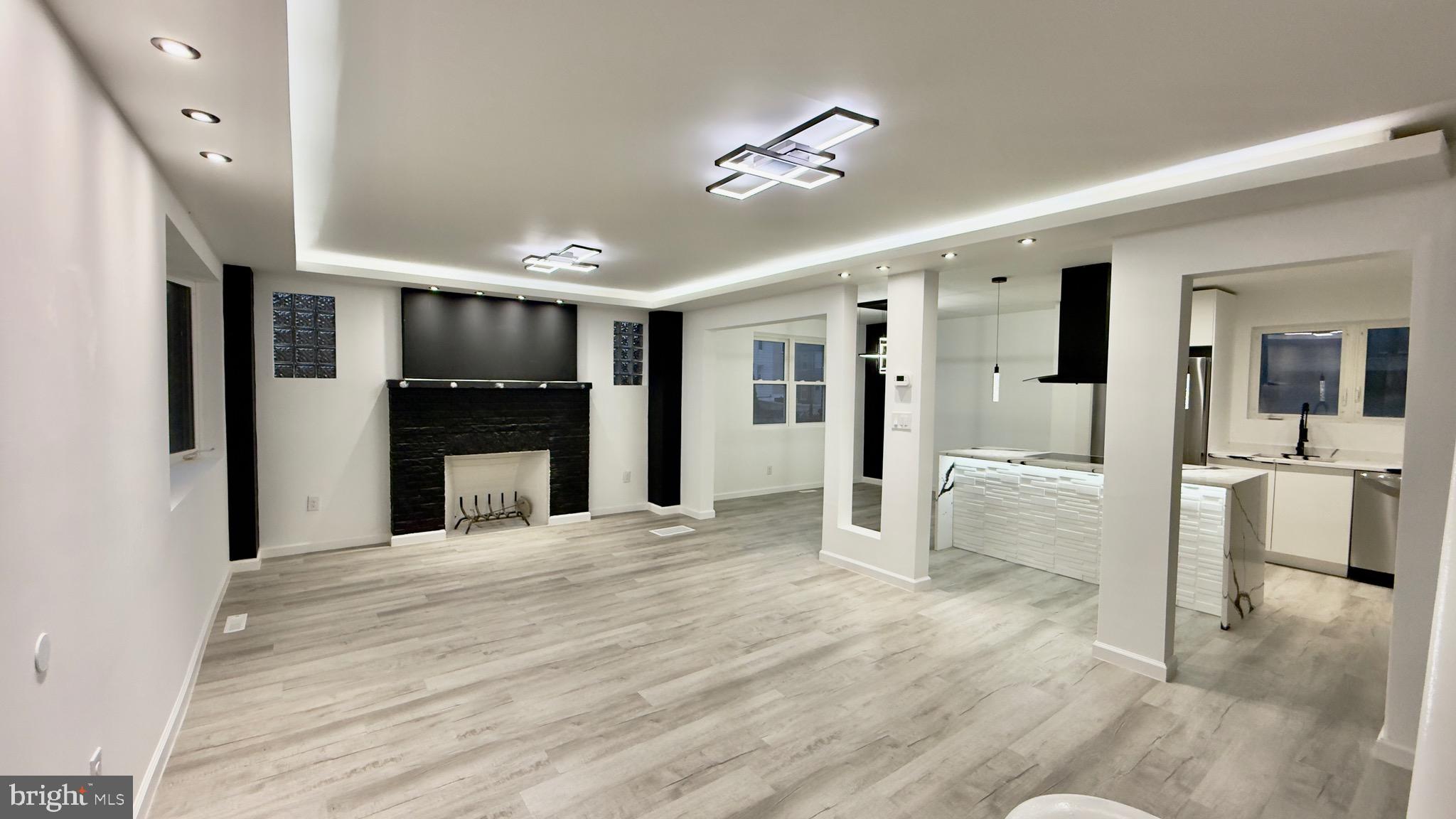 2319 Fairview Avenue Reading, PA 19606 - Photo 3 of 58 a view of a hallway with wooden floor and chandelier