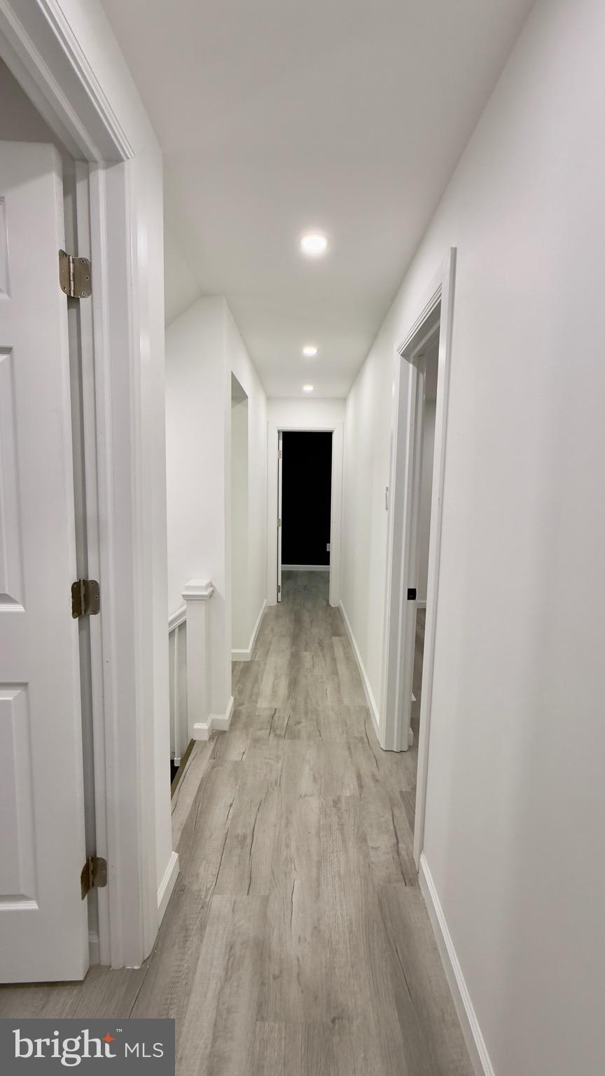 2319 Fairview Avenue Reading, PA 19606 - Photo 34 of 58 a view of a hallway with wooden floor and staircase