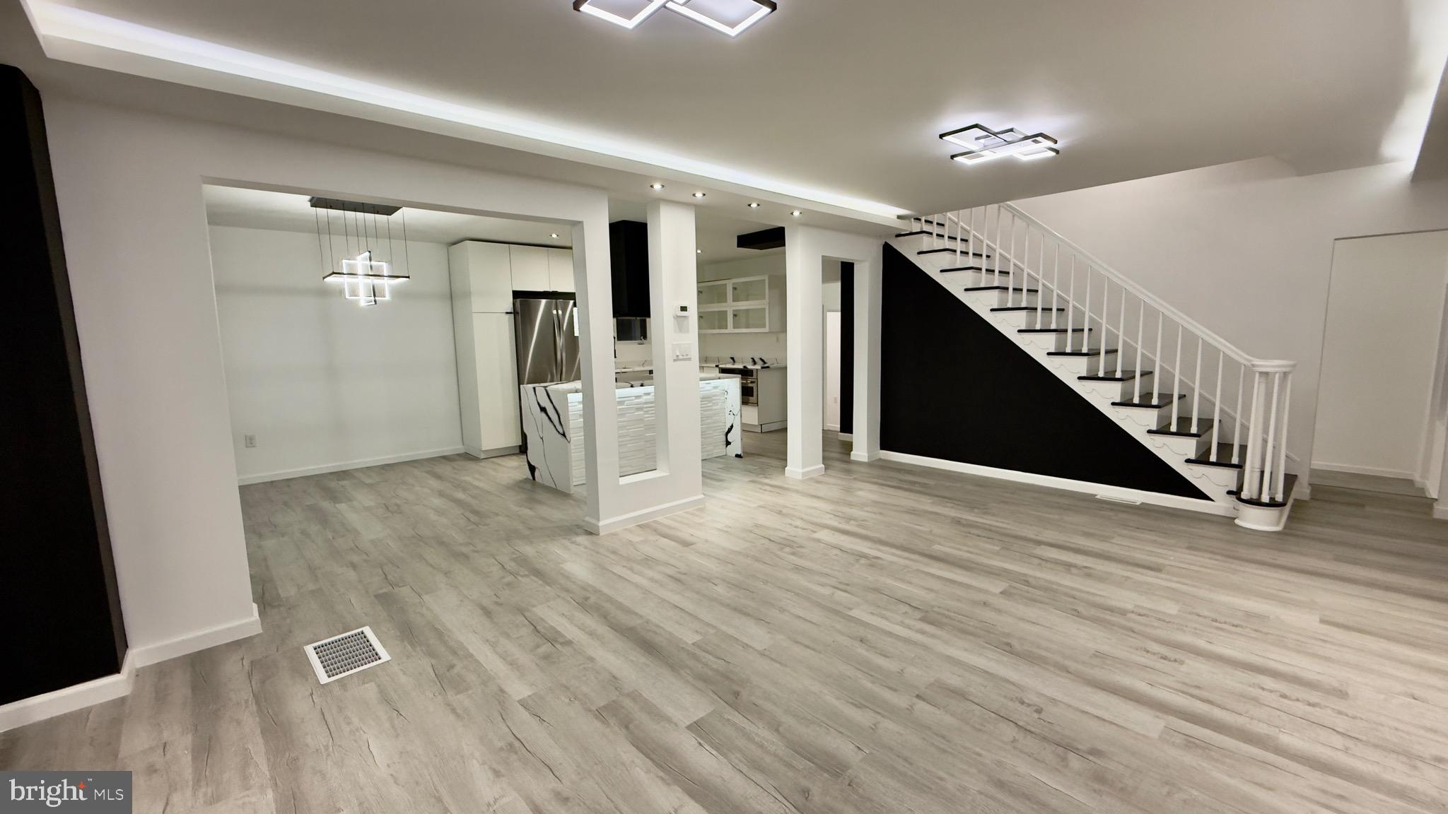 2319 Fairview Avenue Reading, PA 19606 - Photo 4 of 58 a view of a livingroom with wooden floor and stairs